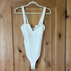 Free People bodysuit with snaps- never worn